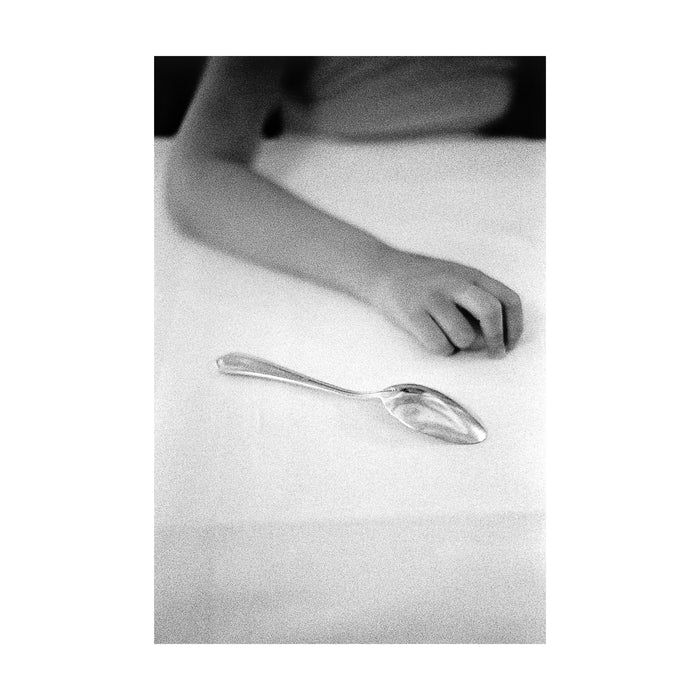 Untitled (hand and spoon)